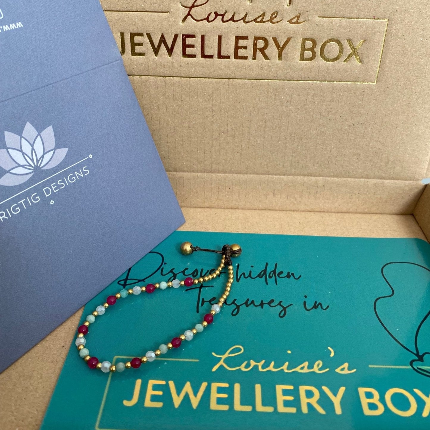 Beaded Amazonite Crystal Healing Bracelet for Health from Rigtig Designs with gold and red beads.