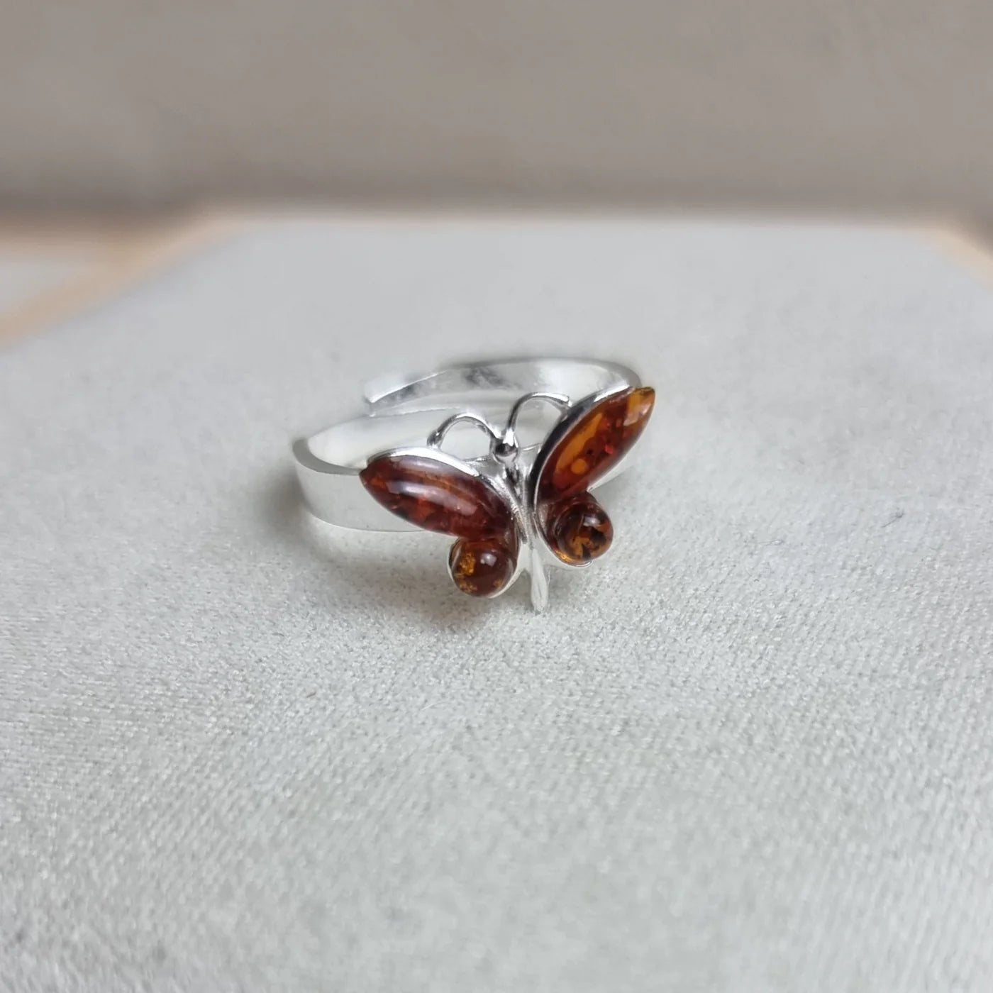 Butterfly Adjustable Ring in Sterling Silver with Cognac Baltic Amber - Louise's Jewellery Box