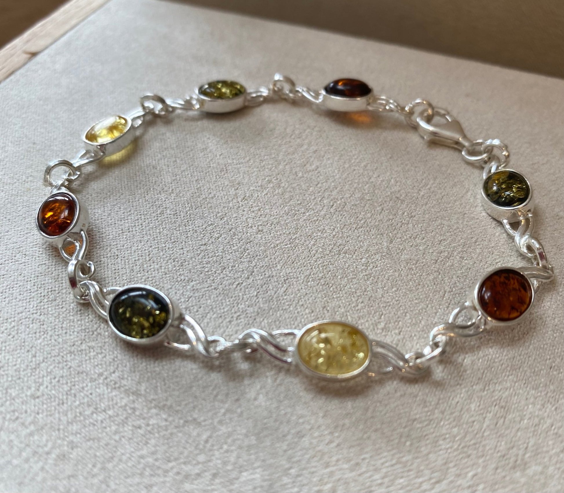 Celtic Inspired Link Bracelet in Sterling Silver with Mixed Baltic Amber Stones - Louise's Jewellery Box