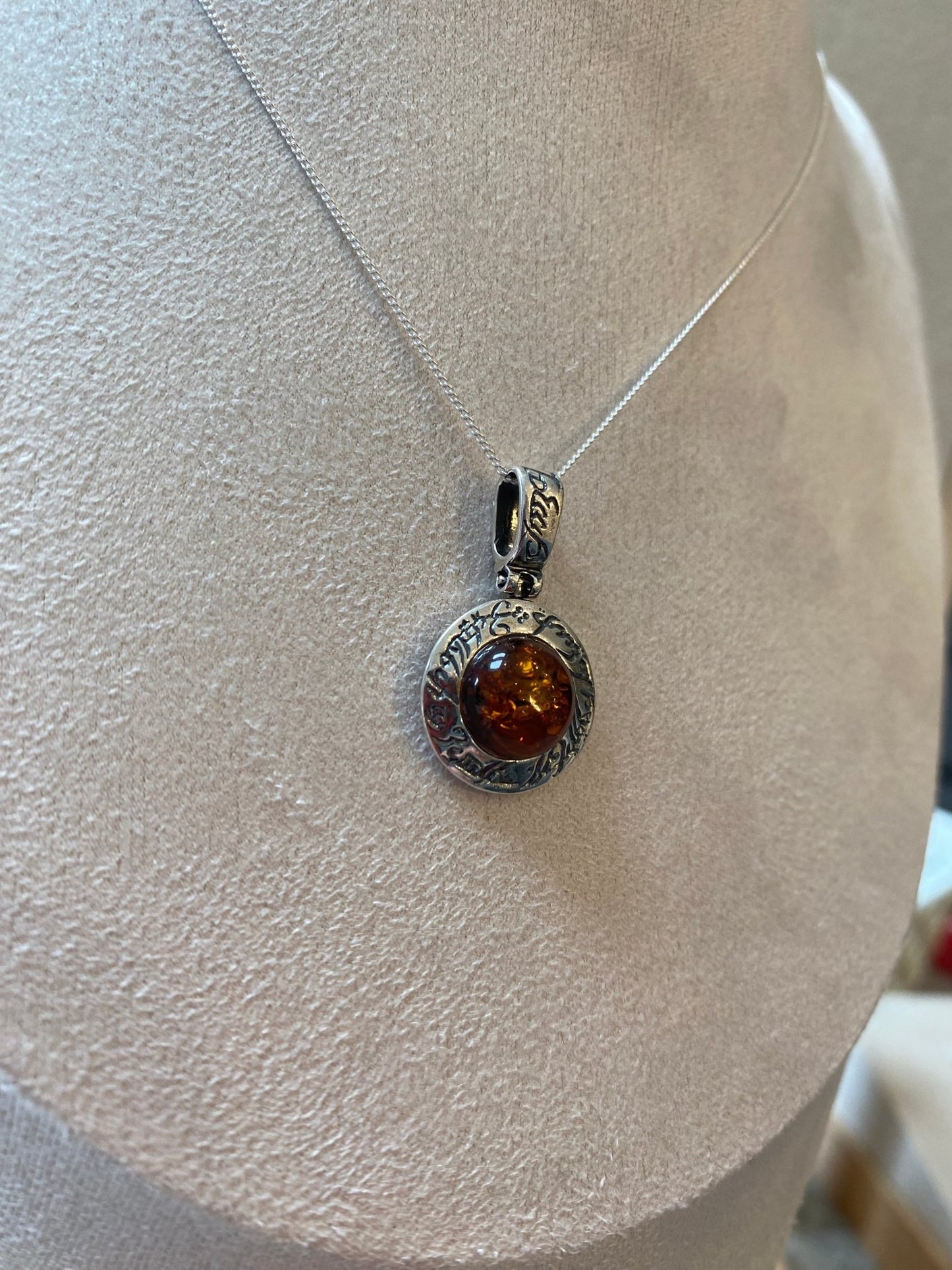 Round Stirling Silver Pendant with Cognac Baltic Amber Stone and Mystical Etchings - Louise's Jewellery Box