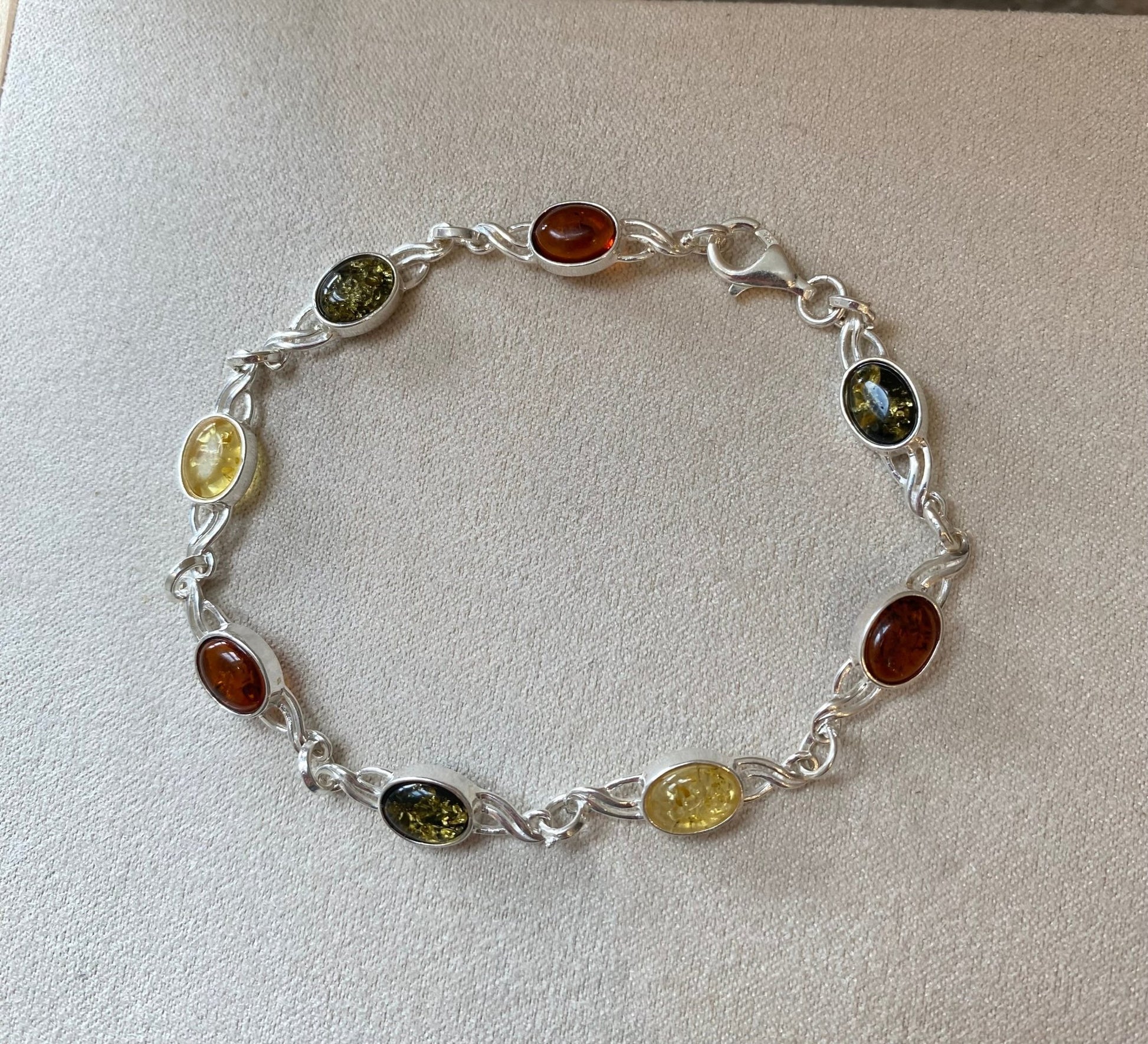 Celtic Inspired Link Bracelet in Sterling Silver with Mixed Baltic Amber Stones - Louise's Jewellery Box