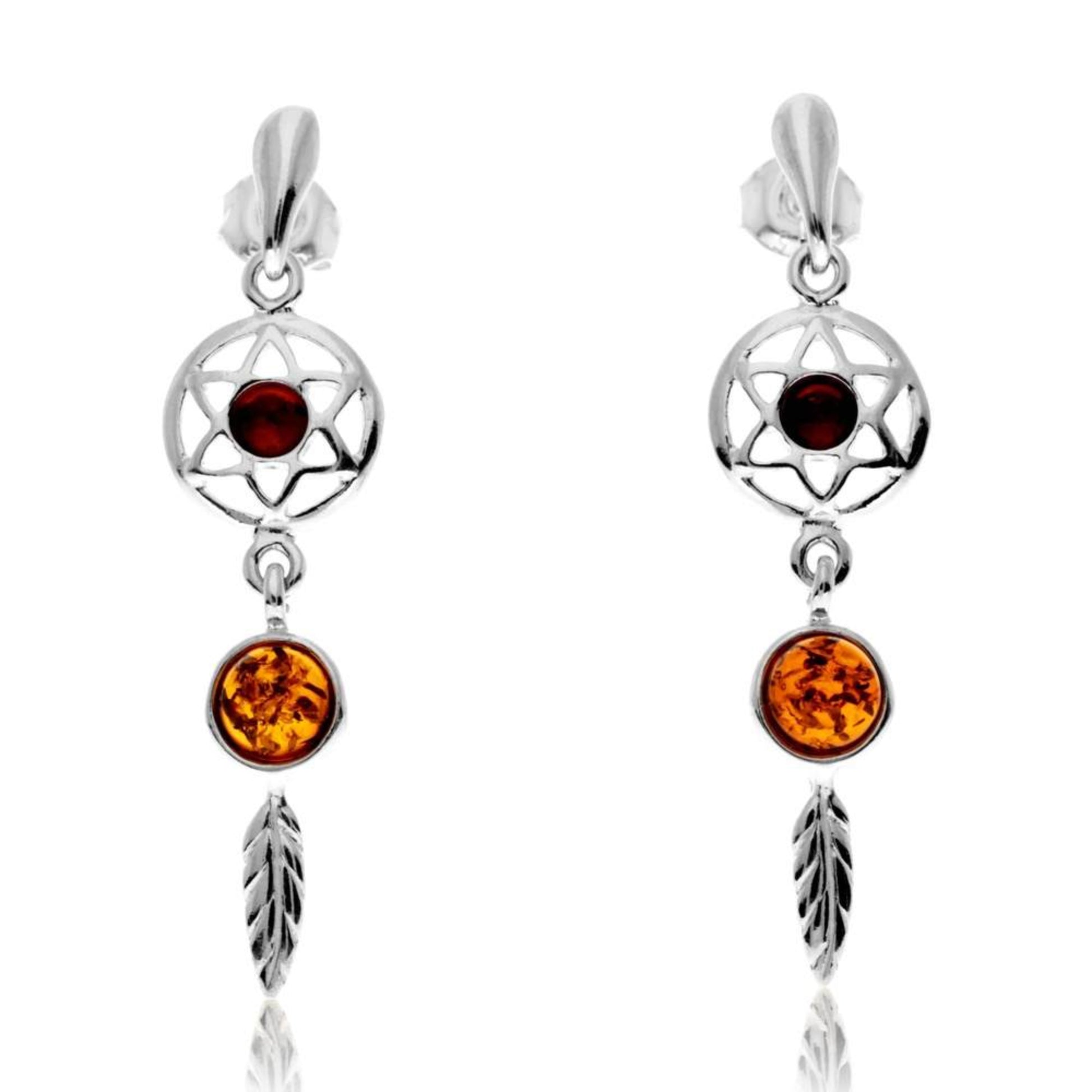Sterling silver dreamcatcher earrings with cognac Baltic amber from Sterlina, featuring star and feather charms.