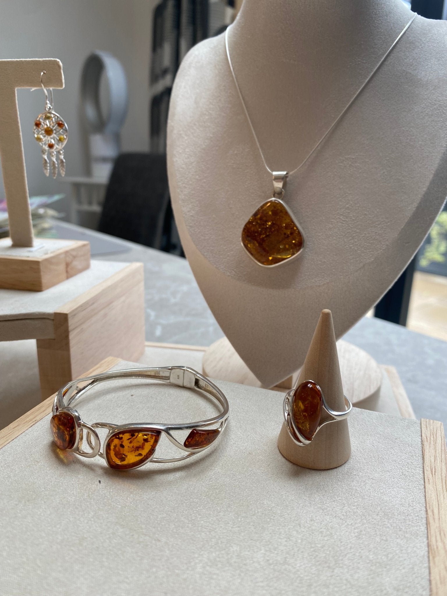 Hinged Bangle in Sterling Silver with Cognac Baltic Amber - Louise's Jewellery Box
