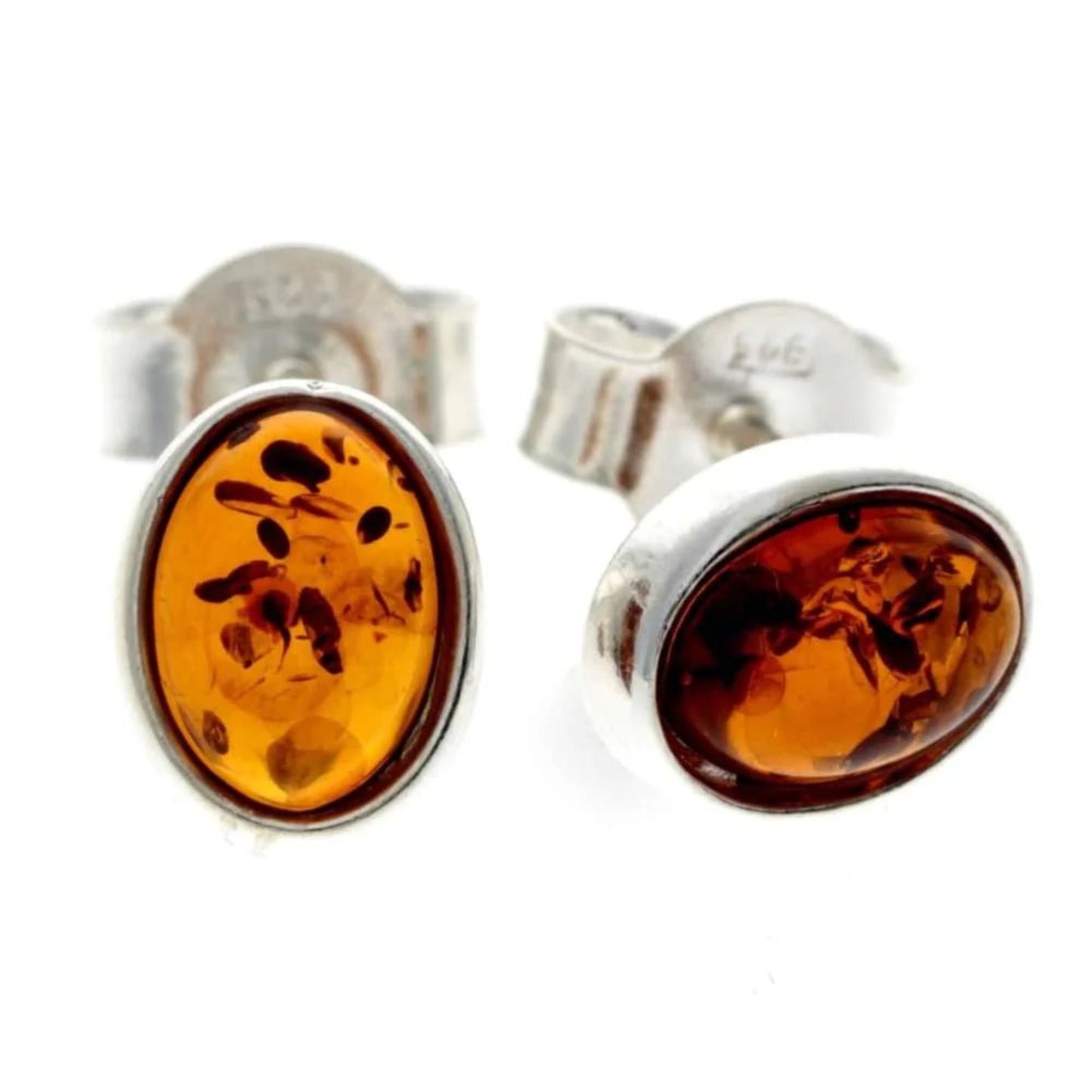Oval stud earrings in sterling silver and cognac Baltic amber with post backings.