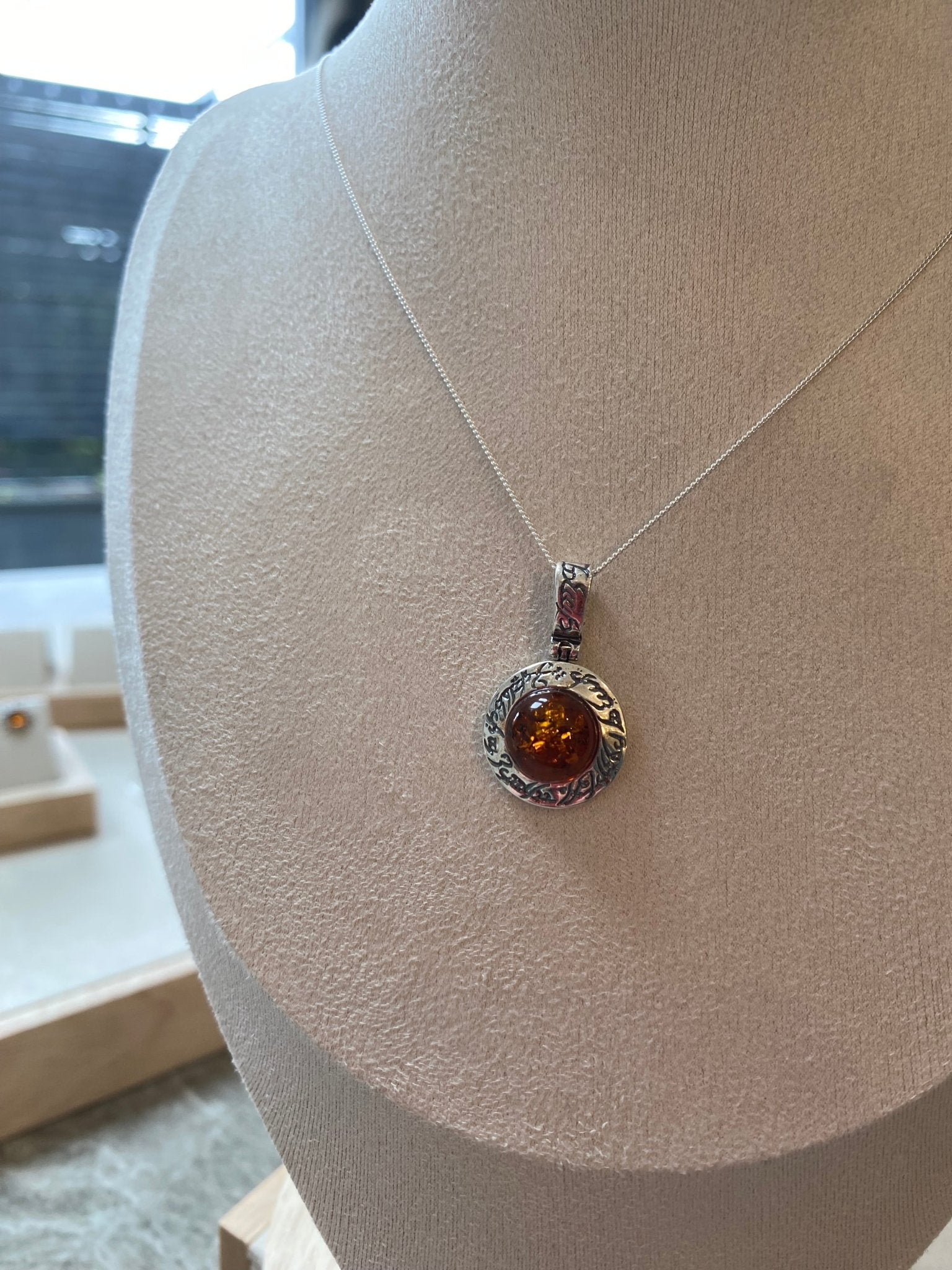 Round Stirling Silver Pendant with Cognac Baltic Amber Stone and Mystical Etchings - Louise's Jewellery Box