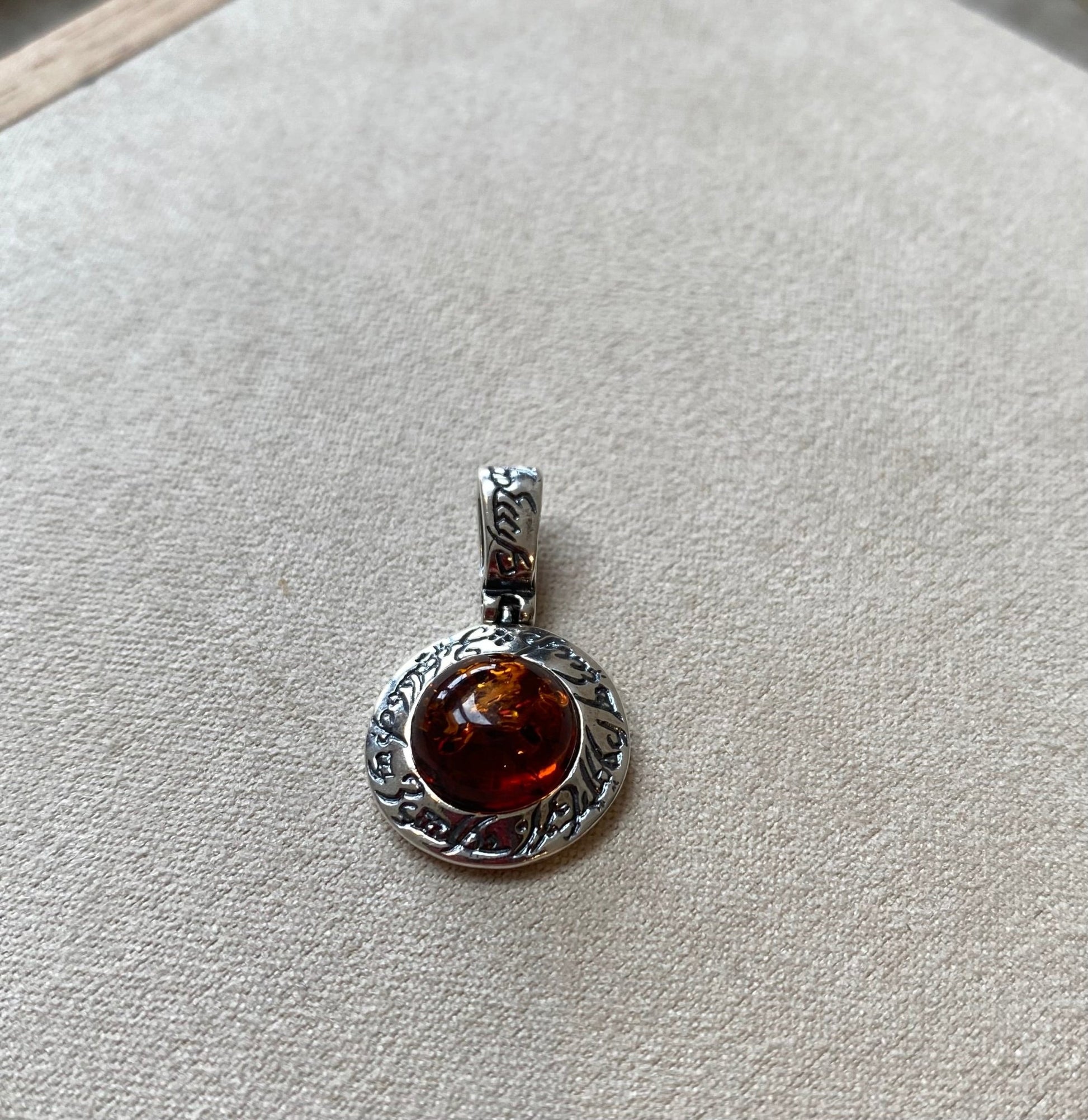 Round Stirling Silver Pendant with Cognac Baltic Amber Stone and Mystical Etchings - Louise's Jewellery Box