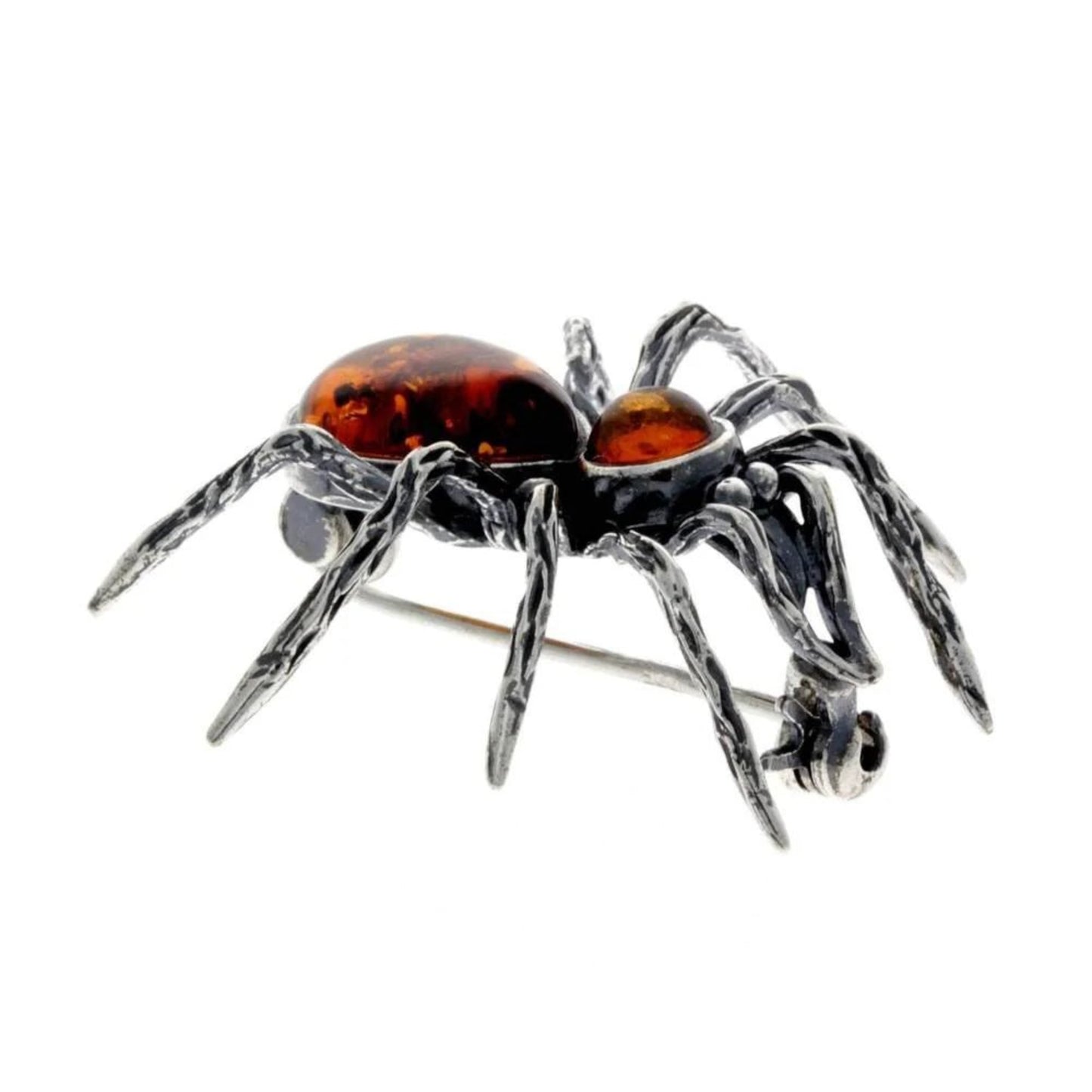Spider brooch in sterling silver with baltic amber from Baltinester Jewelry, featuring textured legs and pin closure detail.