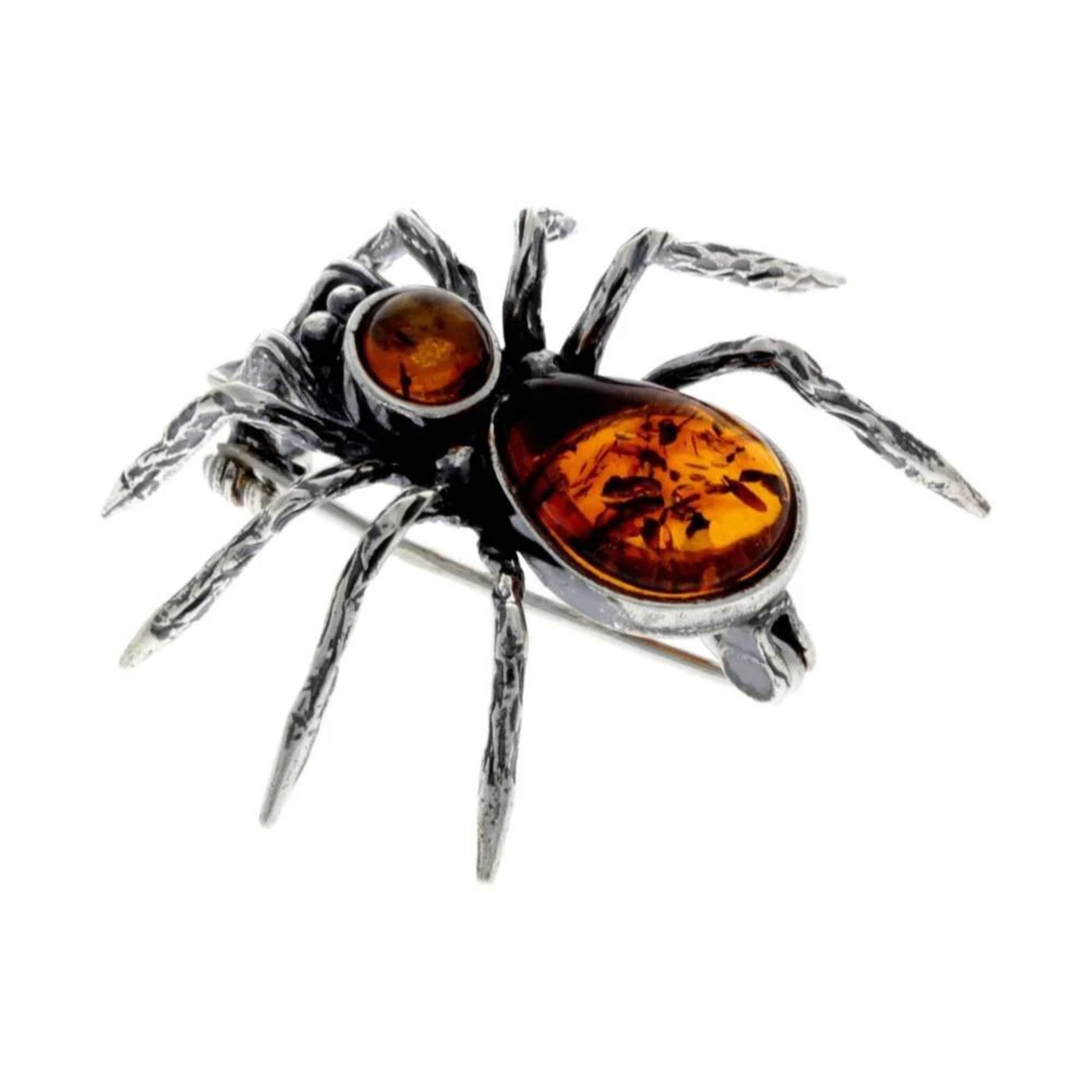 Spider brooch in sterling silver with baltic amber, detailed legs and pin on the back.