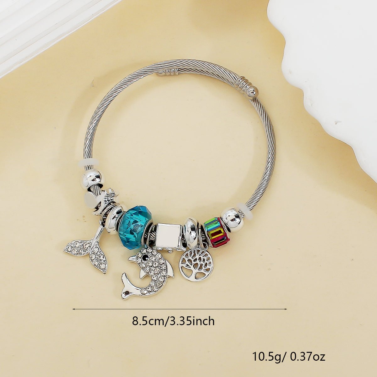 Stainless Steel Flexible Bangle with Lucky Charms in Blue - Louise's Jewellery Box