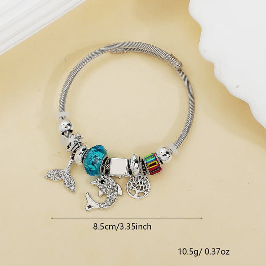 Stainless Steel Flexible Bangle with Lucky Charms in Blue - Louise's Jewellery Box