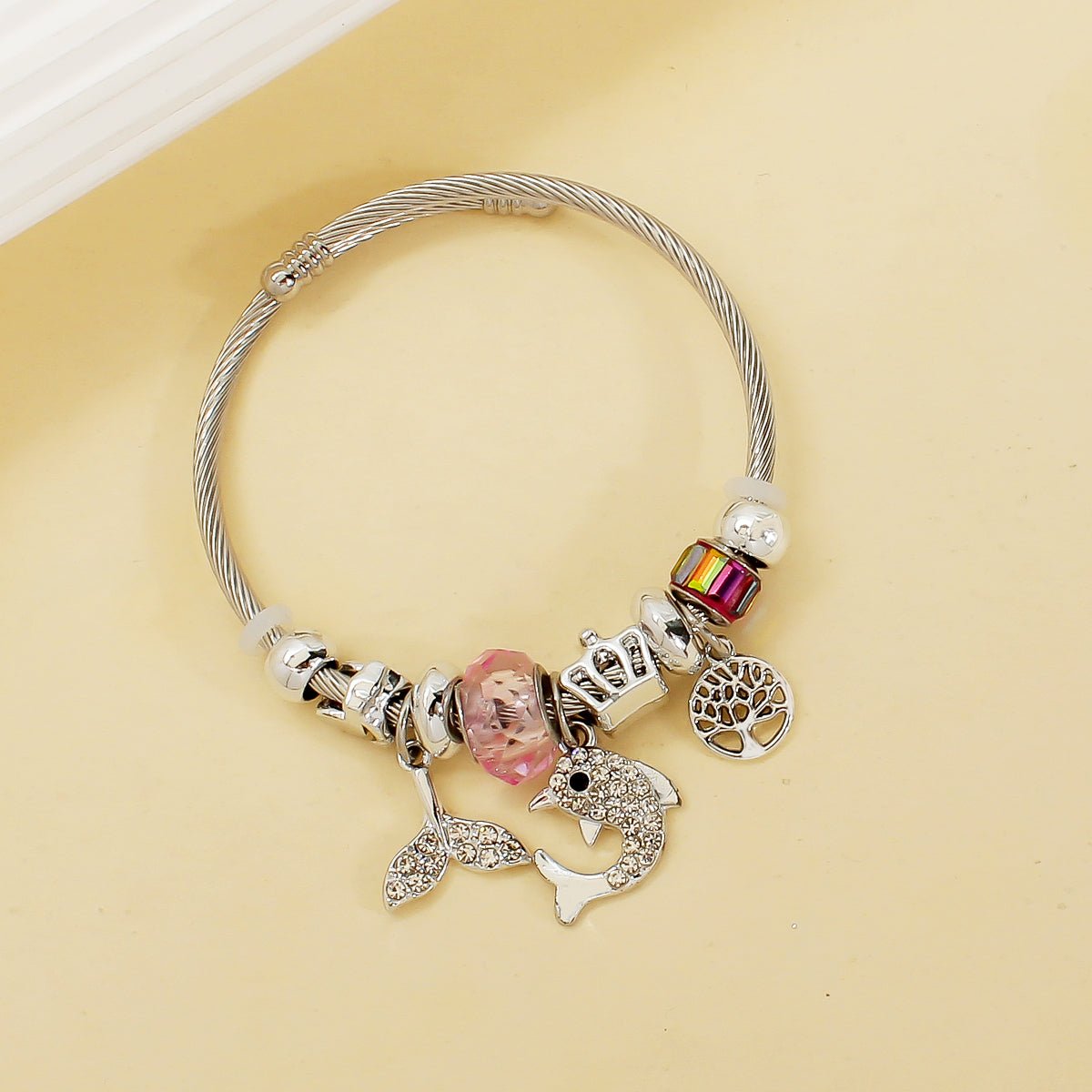 Stainless Steel Flexible Bangle with Lucky Charms in Pink - Louise's Jewellery Box