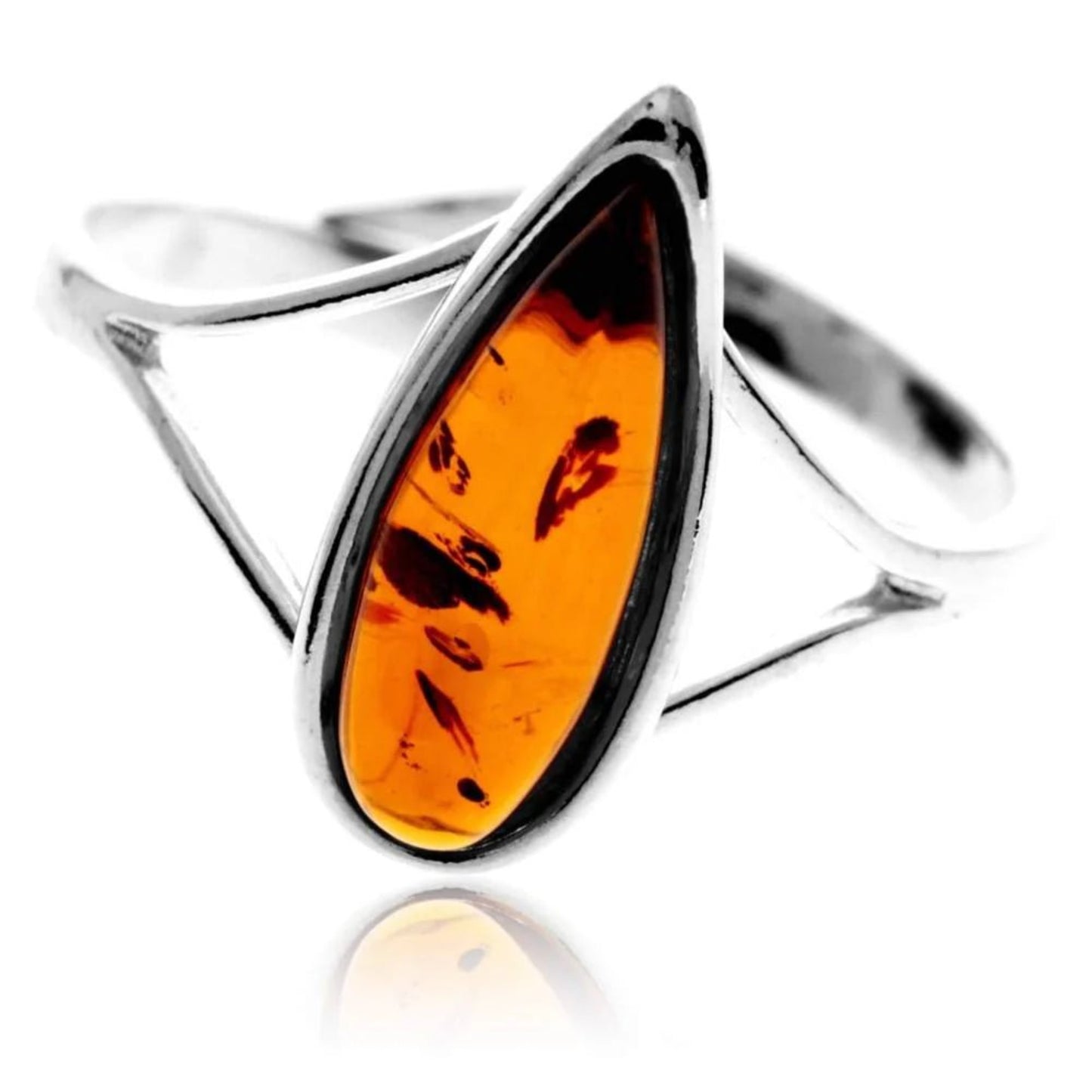Sterling silver teardrop ring with cognac Baltic amber by undisclosed vendor, featuring dark inclusions.